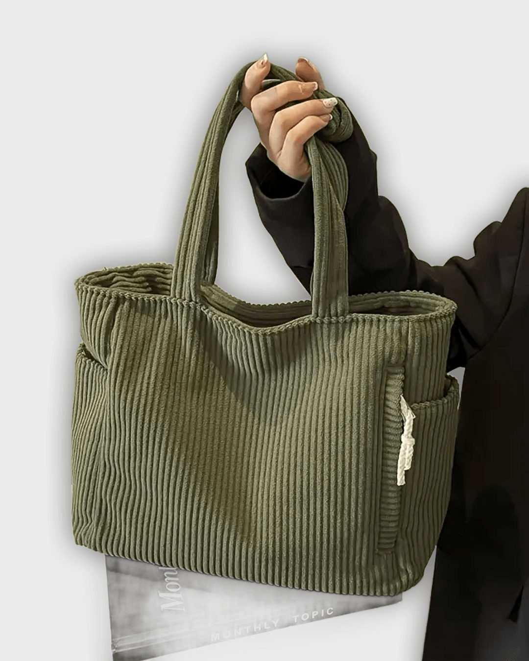 Bolso de mano con detalles en hilo