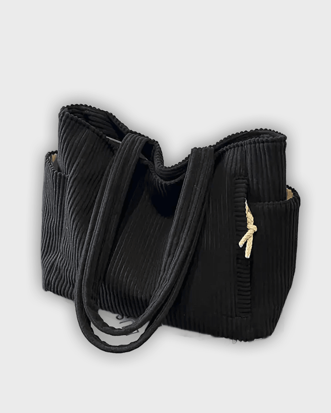 Bolso de mano con detalles en hilo