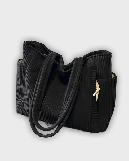 Bolso de mano con detalles en hilo