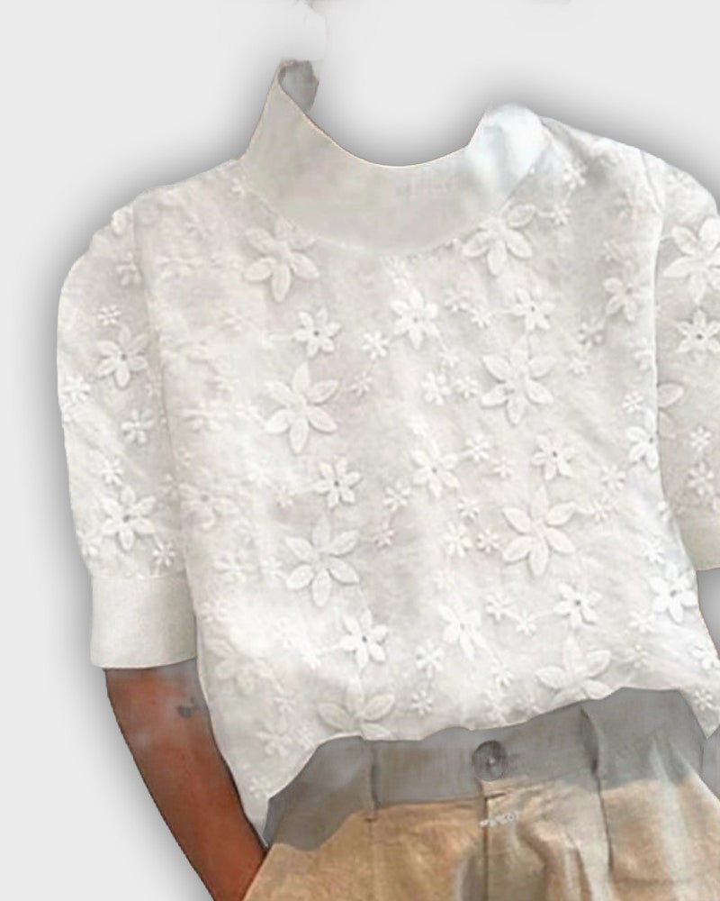 Top elegante de algodón con encaje y cuello de moda