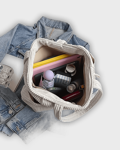 Bolso de mano con detalles en hilo