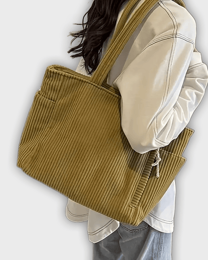 Bolso de mano con detalles en hilo