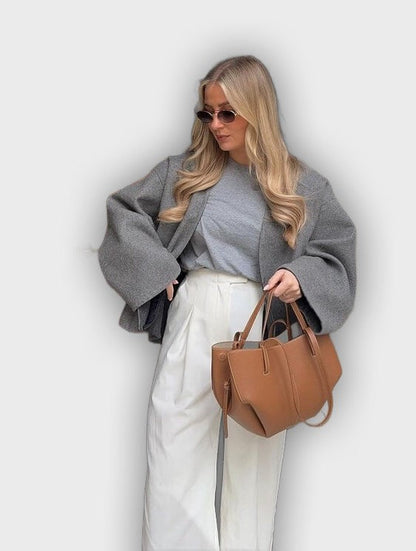 Bolso de mano con pliegues laterales